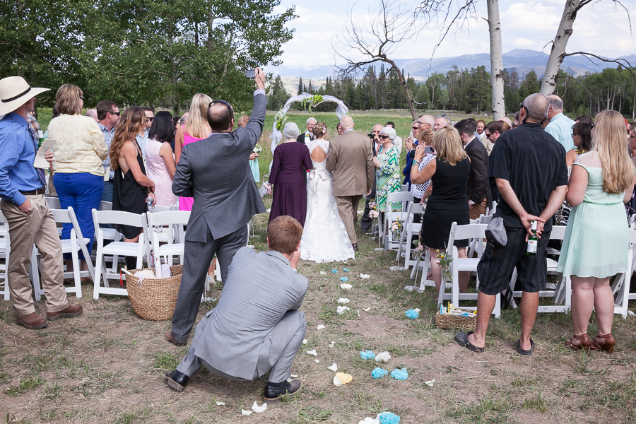 One of the reason to have an "unplugged" wedding is to avoid guests and their cameras getting in the way of the images that the couple paid the photographer that they spent a lot of time and money selecting and hiring to capture their special day.